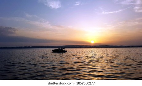 boat ride at orange sunset