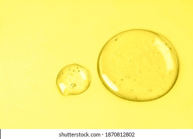 Liquid gel or drop of serum. Gel and cosmetic texture. Drops of liquid transparent gel close-up.