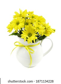 Yellow chrysantumum flowers in a white jar with ribbon bow isolated on white background