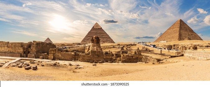 The Sphinx by the Great Pyramids of Egypt near the ruins of a temple in Giza