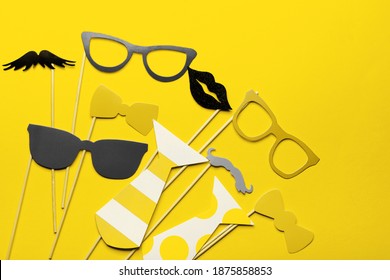 Photo booth props glasses, mustache, lips on Illuminating and Ultimate gray pantone color of the year 2021. Birthday parties and weddings.
