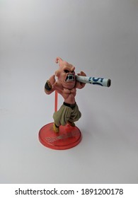 Figure of Majin Buu from Dragon Ball Z is standing on white background