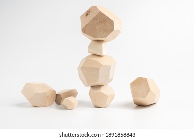 Tumi-ishi puzzle game. Construction of an unstable wooden block tower. The process of the game. Stones for Rock Balance.