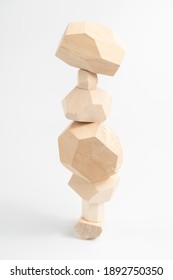 Tumi-ishi puzzle game. Stones for Rock Balance. An unstable tower built from multi-faceted timber bars. Balance and balance.