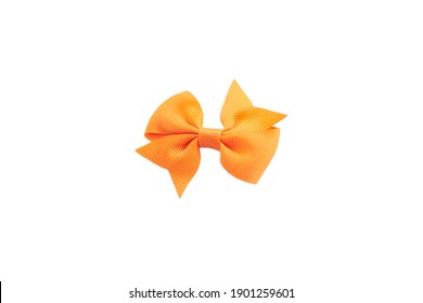 Orange hair bow isolated on white.