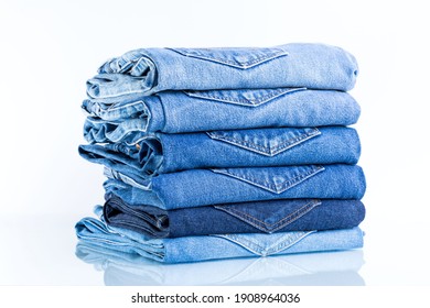 
Jeans trousers stack on white background.concept  jean in supermarket.