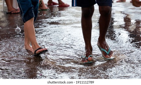 Kids playing in the rain at a vacation program in a neighbourhood in the city of Mariana, Minas Gerais, Brasil.
