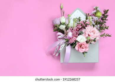 Bouquet sebagai hadiah untuk percutian 8 Mac, Hari St. Valentine, hari ibu, hari jadi, hari perkahwinan. Susunan bunga tulip, eustoma, ranunculus, orkid, kekwa, dahan kayu putih.