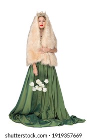 Fashion photo of a beautiful elegant young teenager girl with long curly hair in a crown. pretty long green skirt and fur cape isolated on white background. Russian beauty