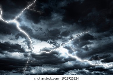 Lightning strike against the background of a cloudy dark sky.