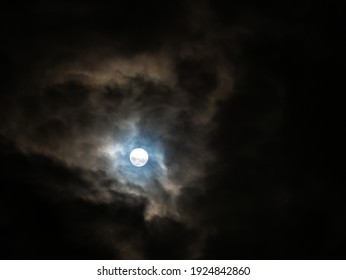 The Clouds were All Over The Sky behind The Halo Moon in The Night