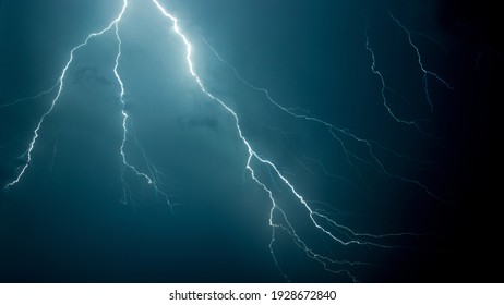 A low angle shot of the scary lightning in the night sky