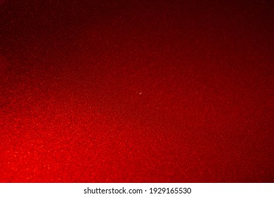 Close up of red metallic car paint surface wallpaper background