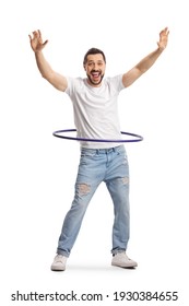 Full length portrait of a happy young man playing with a hula hoop isolated on white background