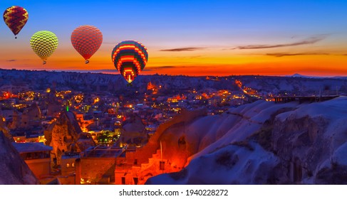 都市ギョレメ国立公園、カッパドキア、トルコのカラフルな熱気球の日の出。