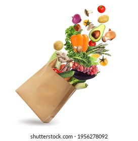 白い背景に野菜や果物が入った紙袋。ベジタリアンフード