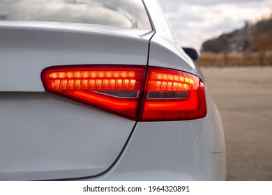 red taillight on white sports car