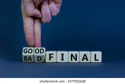 Good or bad final symbol. Businessman turns wooden cubes and changes words 'bad final' to 'good final'. Beautiful grey table, grey background, copy space. Business and good or bad final concept.