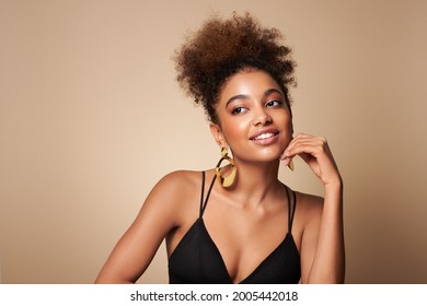 Beauty portrait of African American girl with afro hair. Beautiful black woman. Cosmetics, makeup and fashion