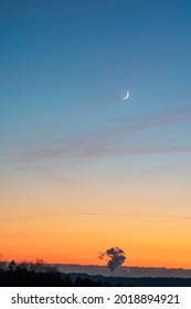 Light blue sky and crescent moon