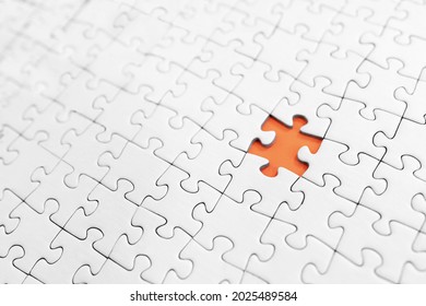 White jigsaw puzzles, with one missing piece