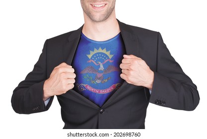 Businessman opening suit to reveal shirt with state flag (USA), North Dakota