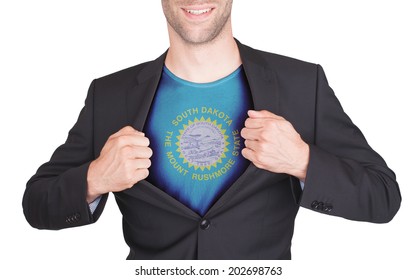 Businessman opening suit to reveal shirt with state flag (USA), South Dakota