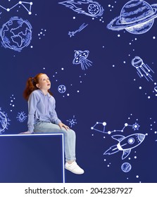Exploring space. Creative artwork with little girl sitting on big box, dreaming looking at drawn planets, asteroids and stars in outer space. Ideas, inspiration, imagination. Collage, illustration