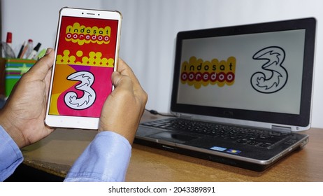 Person Holding Cellphone with Logo of Qatari Telecommunications Company  Ooredoo QSC on Screen in Front of Webpage. Editorial Image - Image of  editorial, focus: 256449975