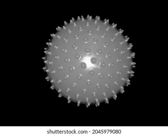 spiked rubber ball gray color black background