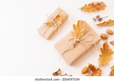 Eco friendly autumn or Thanksgiving gift wraps. Gift boxes, oak leaves and acorns frame. Space for text