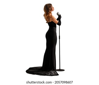 白い壁を背景に黒いドレスを着た美しい少女。孤立したオブジェクト