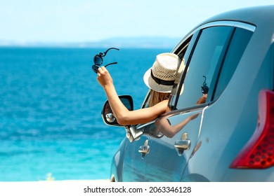 happy driver girl in car at sea in summer concept freedom and happy