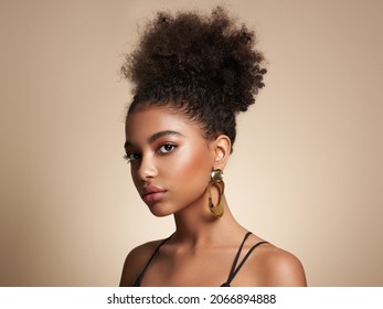 Beauty portrait of African American girl with afro hair. Beautiful black woman. Cosmetics, makeup and fashion