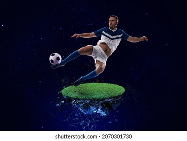 لاعب كرة قدم يركل الكرة إلى الفضاء