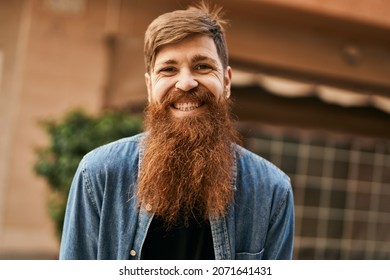 Young irish hipster man smiling happy standing at the city.