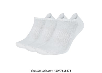 Three white socks isolated on white background. Three pair of socks. Set of short socks for sports on invisible foot as mock up for advertising, branding, design.
