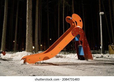 Nobody in the snow covered children's playground. Winter time, night view. High quality photo