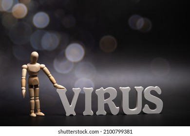 la palabra Virus en fondo oscuro con bokeh. Omikron es el nuevo tipo de coronavirus de Sudáfrica, marcado como B.1.1.529