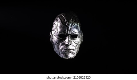futuristic iron mask on black background