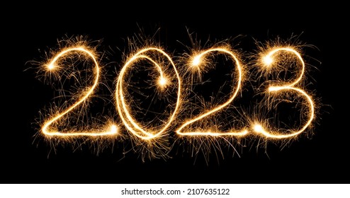 Gelukkig Nieuwjaar 2023. Brandende sprankelende tekst 2023 geïsoleerd op zwarte achtergrond. Mooi gloeiend ontwerpelement voor wenskaart en vakantieflyer