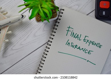 Final Expense Insurance write on a book isolated on Wooden Table.