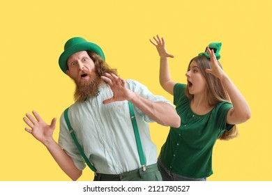 Pasangan muda yang emosional dengan latar belakang kuning. Perayaan Hari St. Patrick