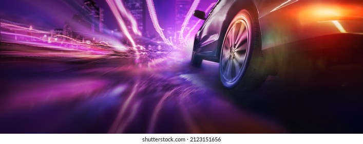 Sport car wheel drifting on night of city lighting background