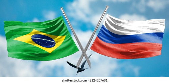 Russische und brasilianische Flaggen flattern zusammen im Wind Am 16. Februar wird Wladimir Putin Gespräche mit dem brasilianischen Präsidenten Jair Bolsonaro führen
