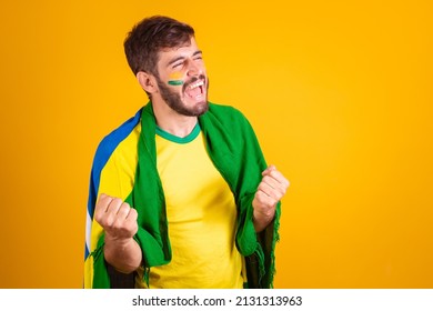Brazilian man, latin american, cheering for brazil, in the world cup 2022, fan, brunette, celebrating, vibrating, happy screaming goal, handsome.