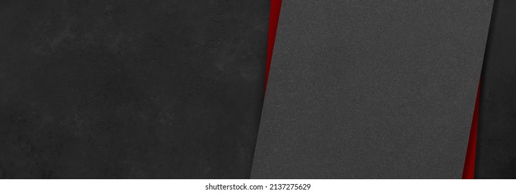 Black and red rectangular mockups on a dark concrete background. Design elements or portfolio. Copy space.
