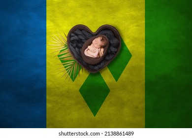 国旗の背景に心の新生児の肖像画。写真の平和のコンセプト。セントビンセントおよびグレナディーン諸島