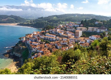 Fishing and tourist town on the coast of Asturias with terraced buildings. The three. North coast of Spain 
