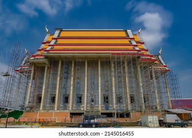 Thai temple under construction.There is a steel scaffold surrounding the building.